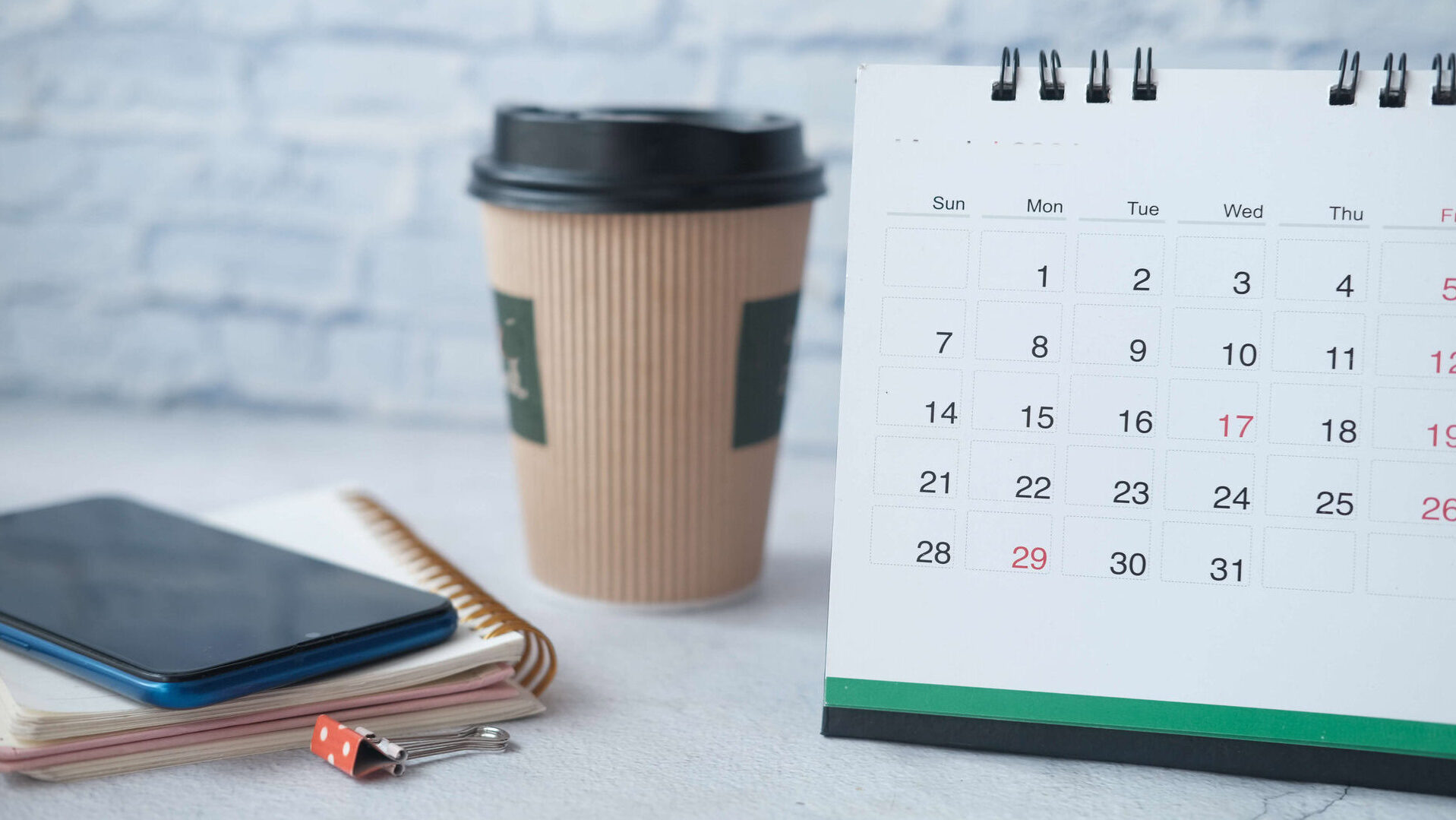 calendar notepad and smart phone on office desk 2024 12 13 09 21 21 utc edited 1