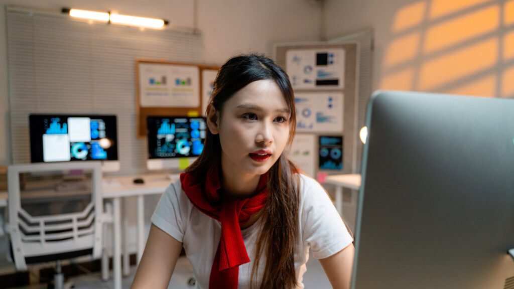 young asian businesswoman analyzing data on comput 2025 03 18 21 16 26 utc